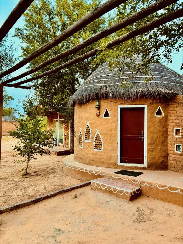 Round cottage with painted white patterns