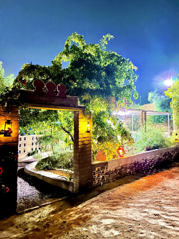 Lantern-lit gate at night